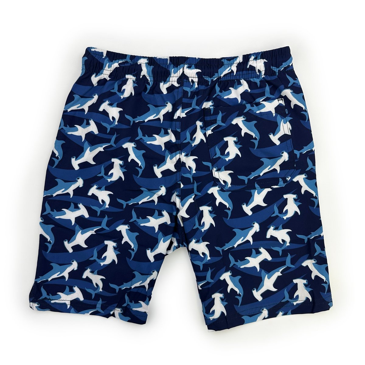 Full back view of men's navy blue boardshorts featuring hammerhead shark pattern
